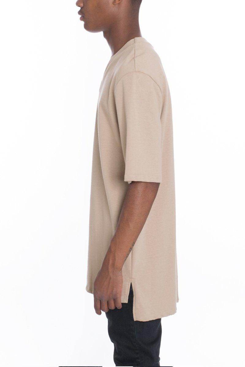 Men's casual vacation top in beige featuring a relaxed fit and side slits for comfort