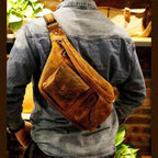Brown leather mens crossbody sling bags worn stylishly over the shoulder for everyday use