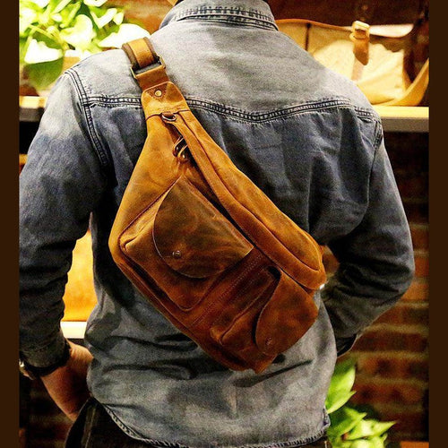 Brown leather mens crossbody sling bags worn stylishly over the shoulder for everyday use