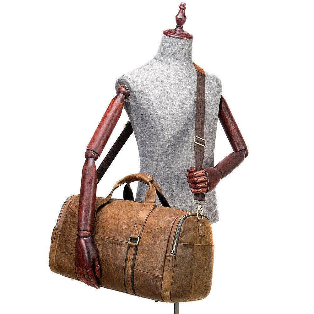 Mens large travel duffel by VacationGrabs in tan leather with sturdy handles and adjustable strap