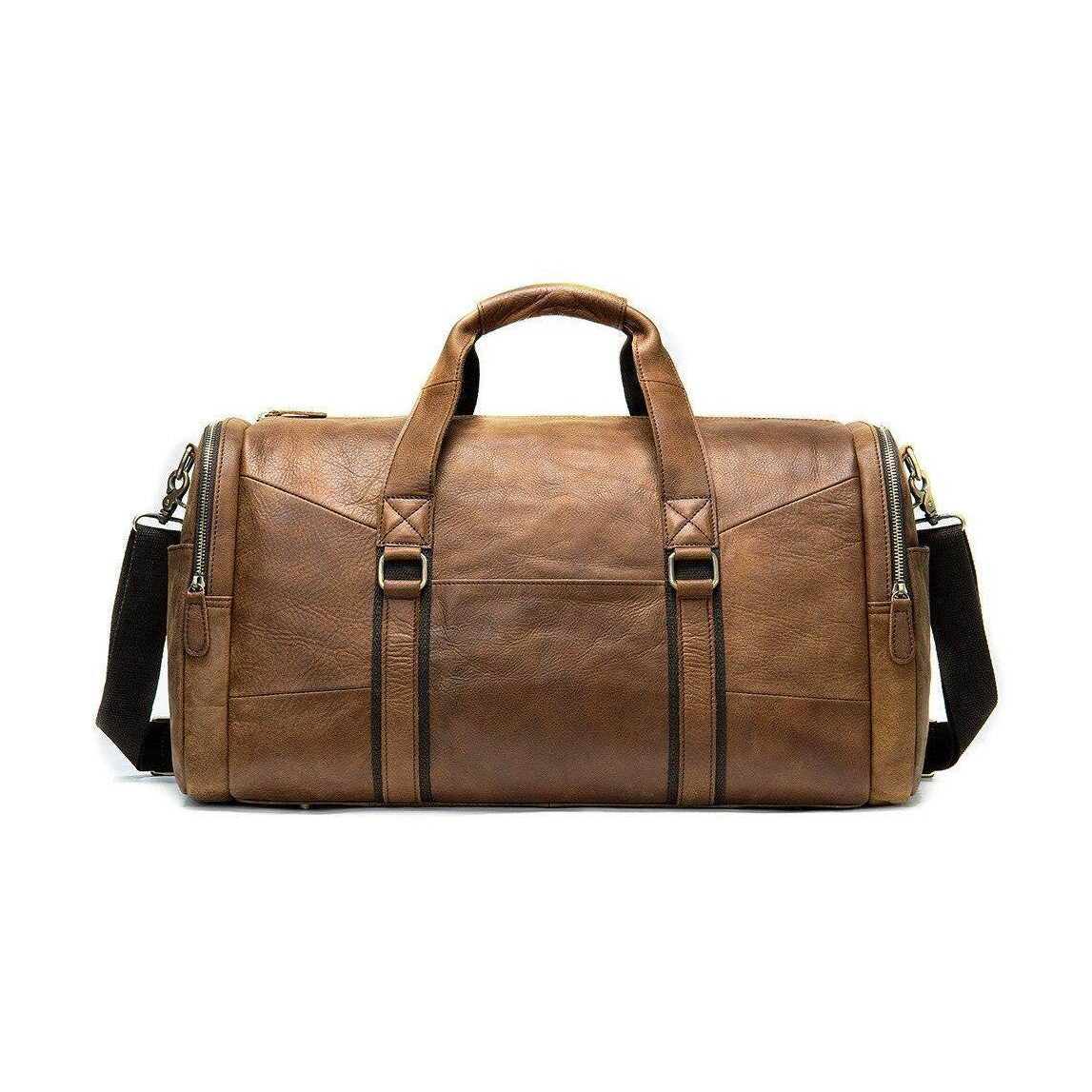 Mens large travel duffel in brown leather with sturdy handles and adjustable strap for versatile use