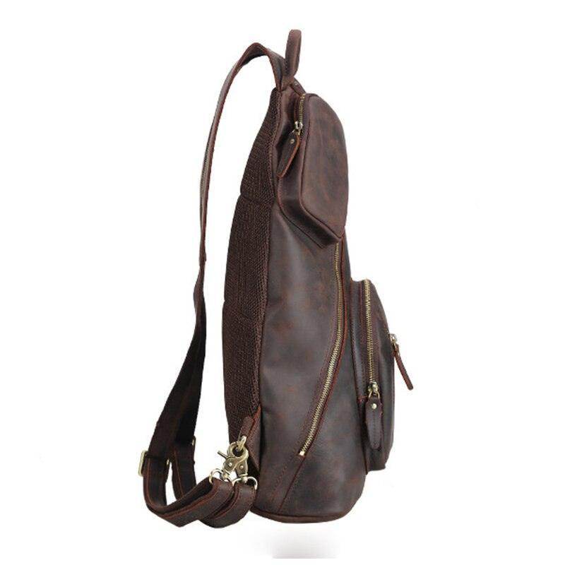 Side view of a mens leather sling bag by VacationGrabs featuring multiple pockets and a durable design