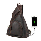 Mens leather sling bag with USB charging port and multiple pockets for convenience