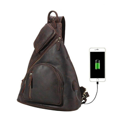 Mens leather sling bag with USB charging port and multiple pockets for convenience