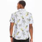 Mens pineapple Hawaiian shirt featuring a vibrant pineapple and palm leaf pattern for casual summer wear