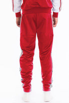 Men's red track pants from VacationGrabs featuring a stylish design and comfortable fit