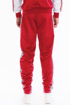 Men's red track pants from VacationGrabs featuring a stylish design and comfortable fit