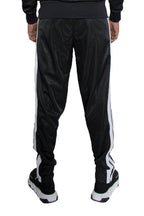 Black mens side stripe track pants by VacationGrabs with a stylish sporty design