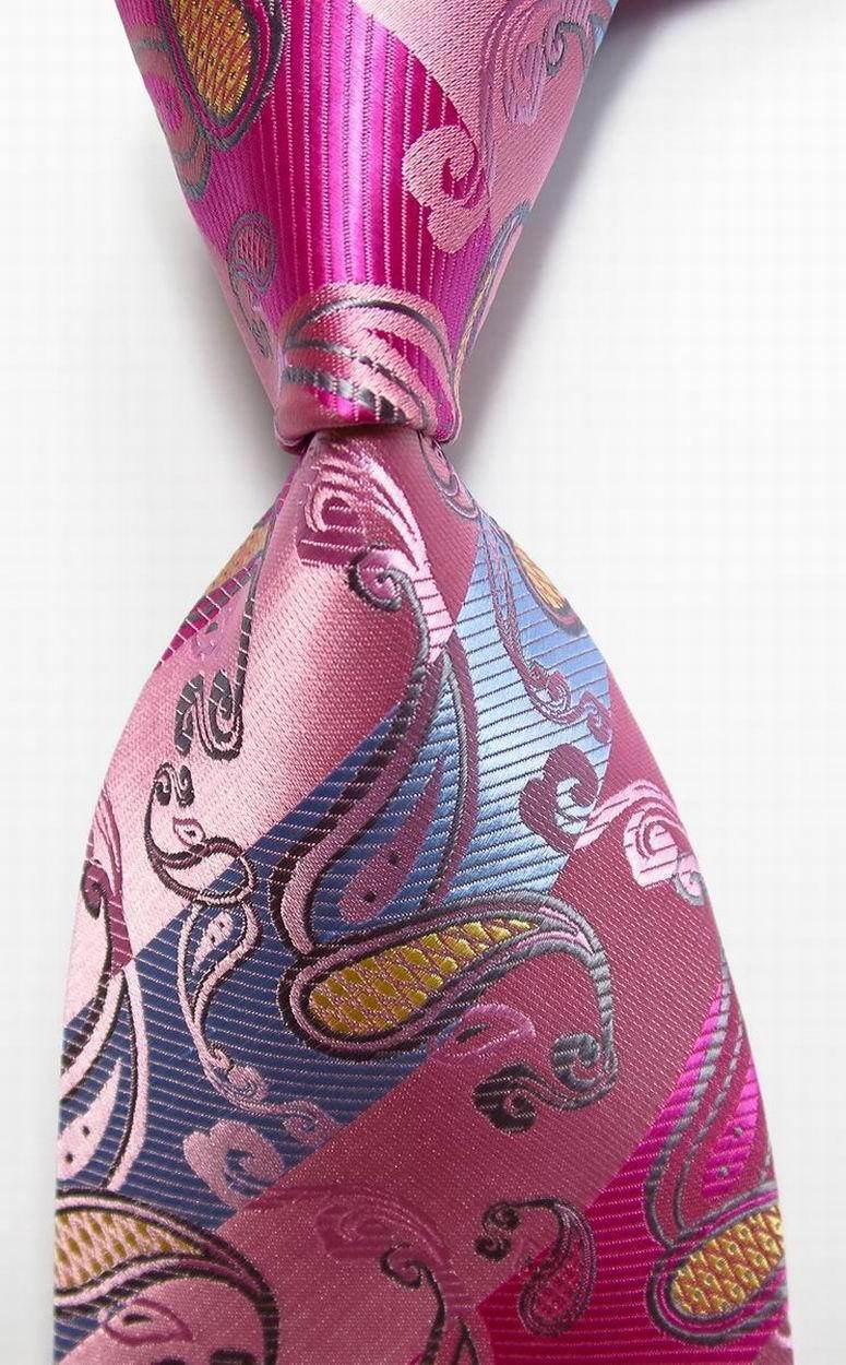 Elegant men's silk neckties with a vibrant pink and blue paisley pattern for formal occasions