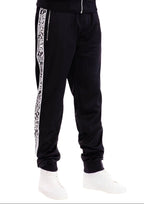 Men's Snake Stripe Track Pants by VacationGrabs with contrasting side stripes for a stylish look