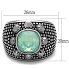 Stylish mens vacation jewelry ring featuring a large light green gemstone and silver accents