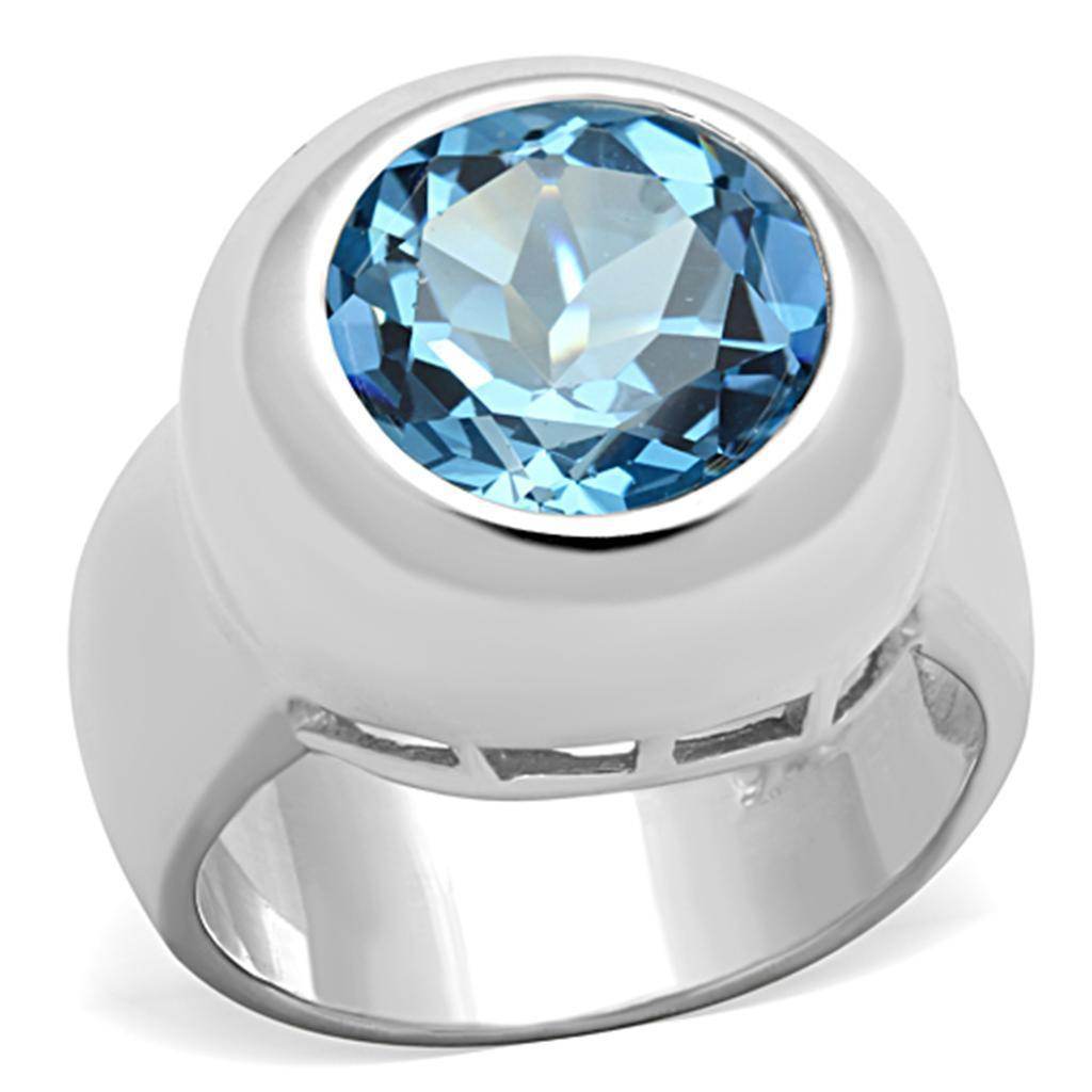 Modern sterling silver cocktail ring featuring a large blue gemstone centerpiece