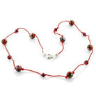 Multicolor resin necklace featuring colorful beads on a red cord for a vibrant accessory