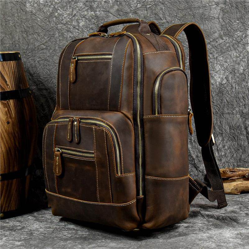 Brown leather multipocket travel backpacks with multiple compartments for organized packing
