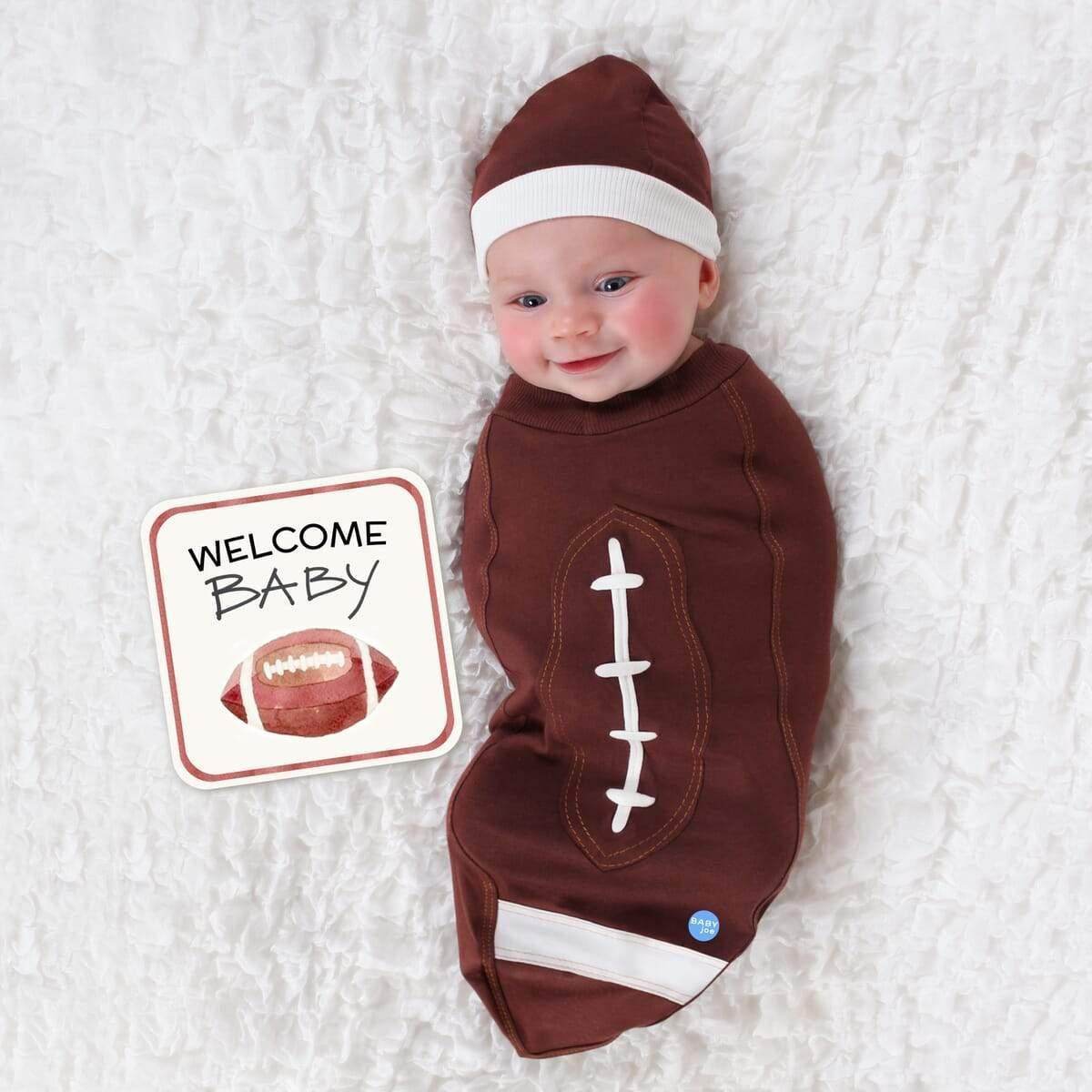 Newborn football outfit in brown with white stitching, perfect for sporty baby photos