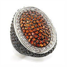 Stunning oval statement cocktail ring featuring intricate design and sparkling accents