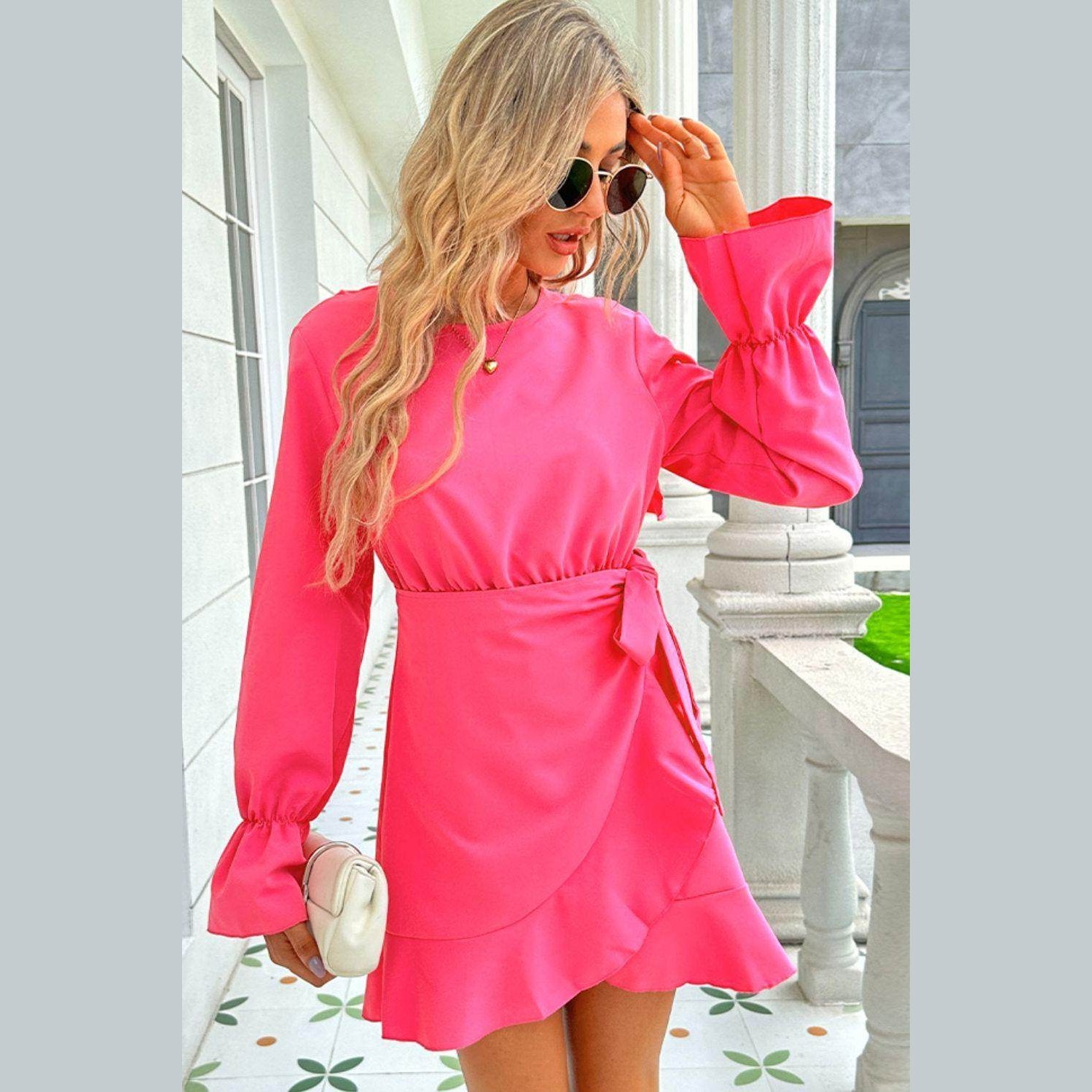 Trendsi pink vacation dress with long sleeves and a stylish wrap design for summer outings