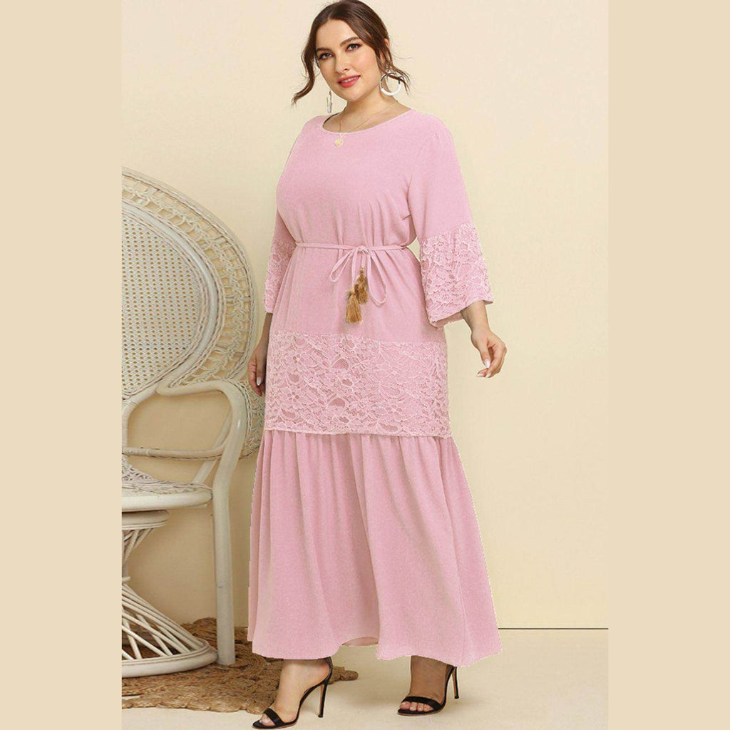 Trendsi Plus Size Lace Dress in soft pink with a belted waist and flared sleeves for a stylish look.