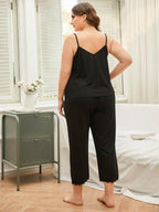 Elegant plus size lace pajama set in black, featuring a comfortable tank top and cropped pants