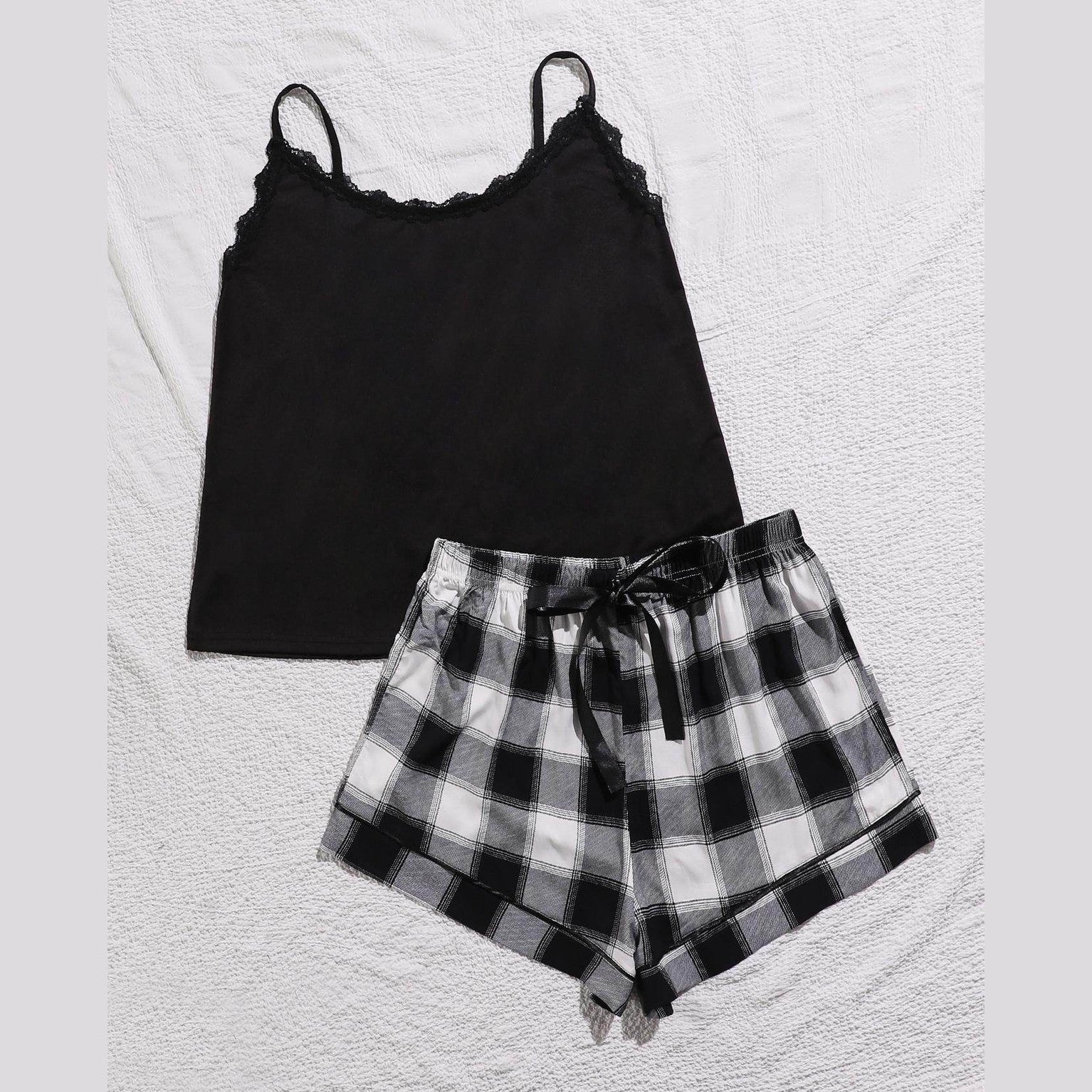 Trendsi plus size scoop neck pajamas set featuring a black camisole and plaid shorts