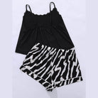 Trendy plus size scoop neck pajamas set in black and zebra print for comfortable loungewear