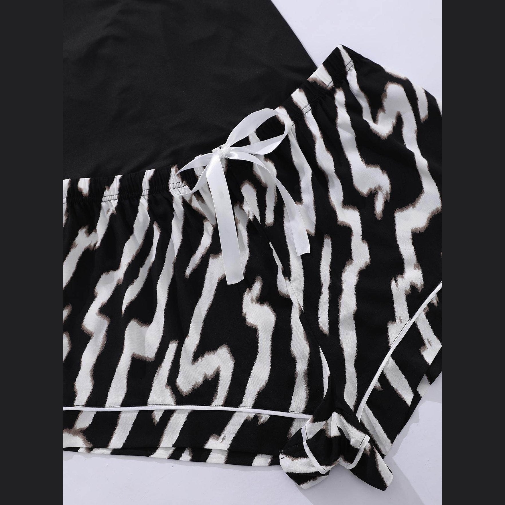 Trendsi plus size scoop neck pajamas in black and white zebra print fabric with adjustable ribbon waist