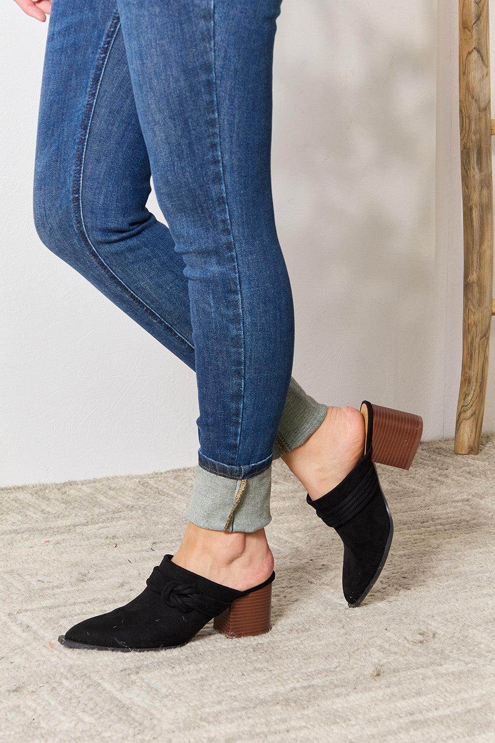 Women's black pointed toe mules with block heel for stylish comfort