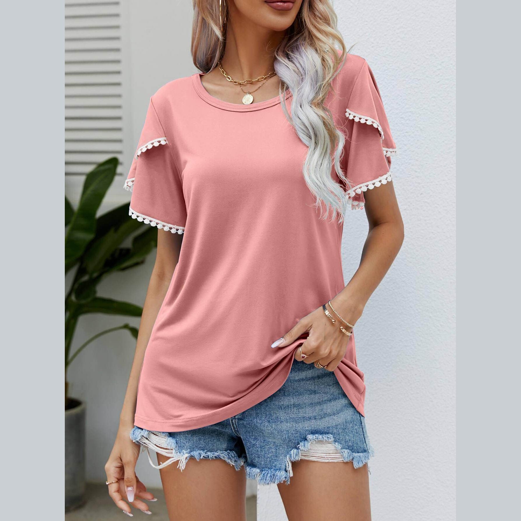 Trendsi Women's pom-pom flutter sleeve tee in blush pink, styled with denim shorts for a casual look