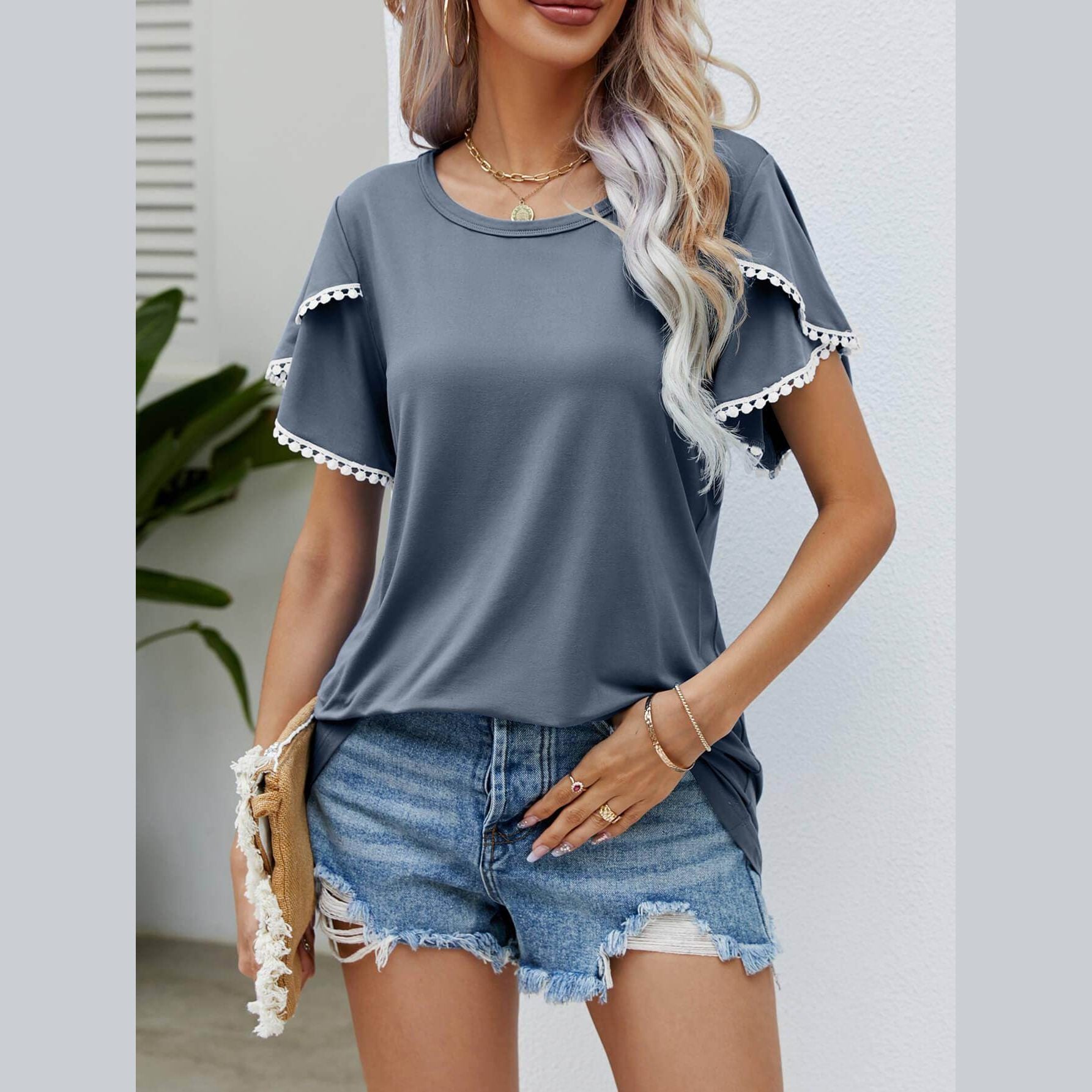 Trendsi Women's pom-pom flutter sleeve tee in gray, paired with denim shorts for a stylish summer look