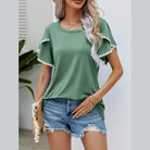Trendsi women's pom-pom flutter sleeve tee in green paired with denim shorts for a casual summer look