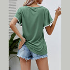 Back view of Women's Trendsi pom-pom flutter sleeve tee in green with stylish detail