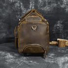 Premium leather wheeled duffel bag in brown with sturdy zippers and multiple pockets for travel convenience