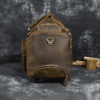 Premium leather wheeled duffel bag in brown with sturdy zippers and multiple pockets for travel convenience