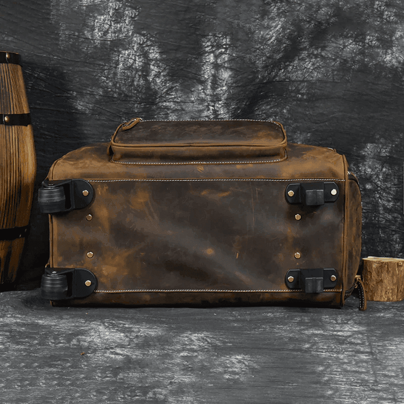 Premium leather wheeled duffel bag with sturdy wheels and durable base for easy transportation