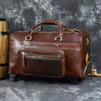 Premium leather wheeled duffel bag in brown with sturdy handles and zipper pockets