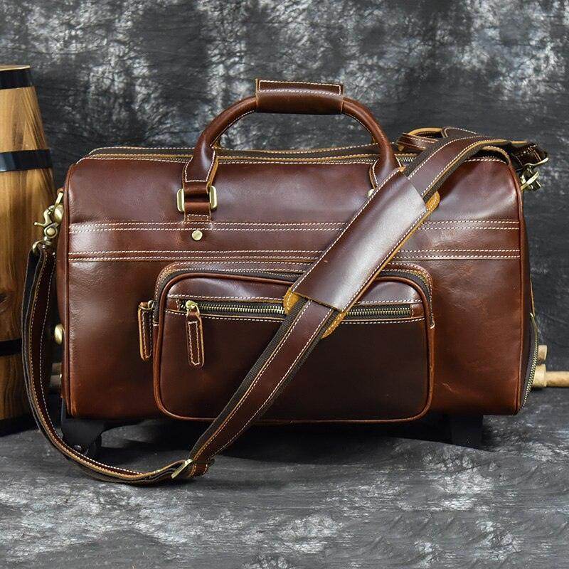 Premium leather wheeled duffel bag with sturdy handle and adjustable shoulder strap for easy travel
