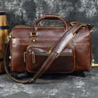 Premium leather wheeled duffel bag with sturdy handle and adjustable shoulder strap for easy travel