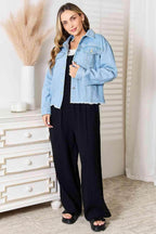 Trendsi raw hem denim jacket styled over a black outfit for a trendy casual look