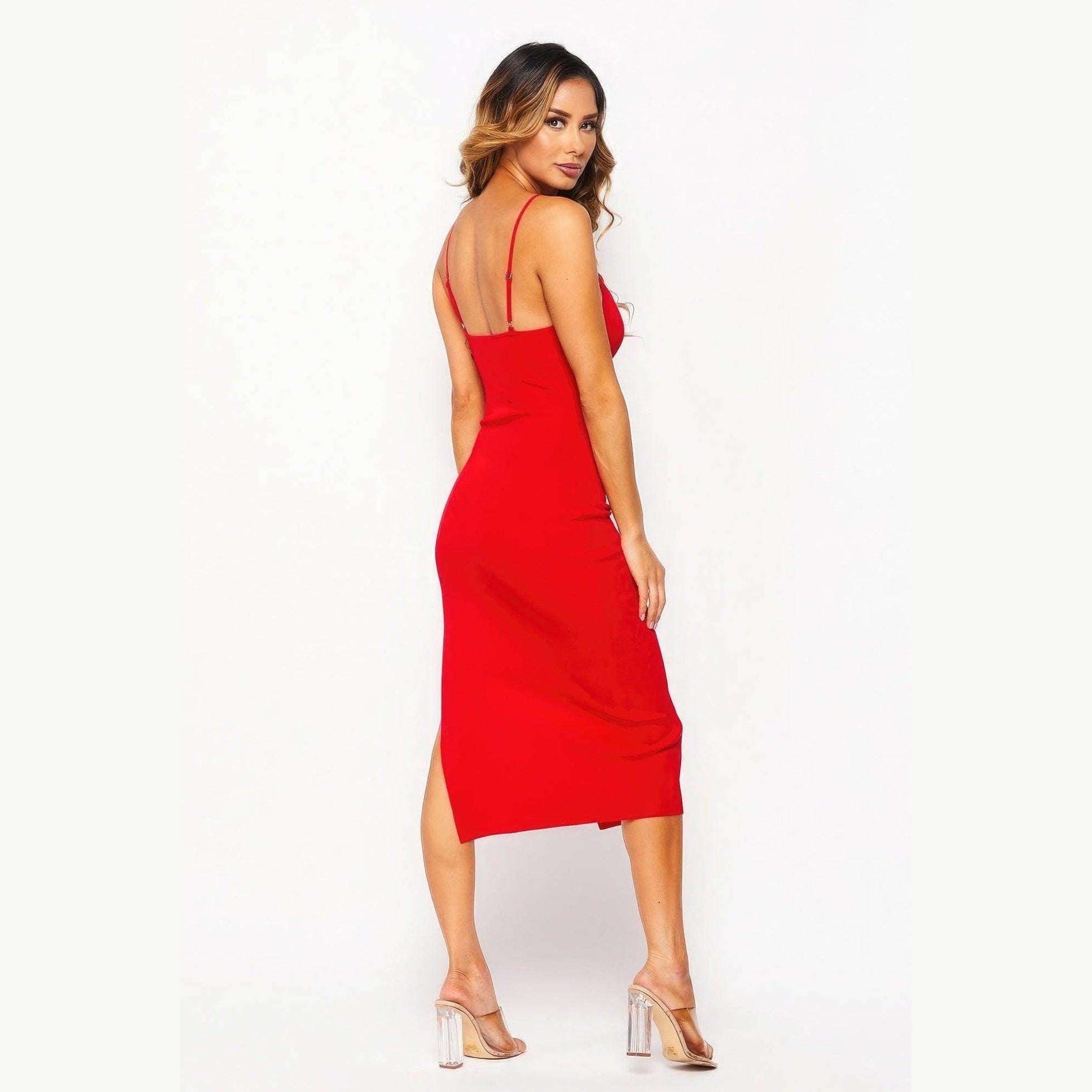 Back view of a woman wearing a red side slit summer dress with thin straps and a sleek fit