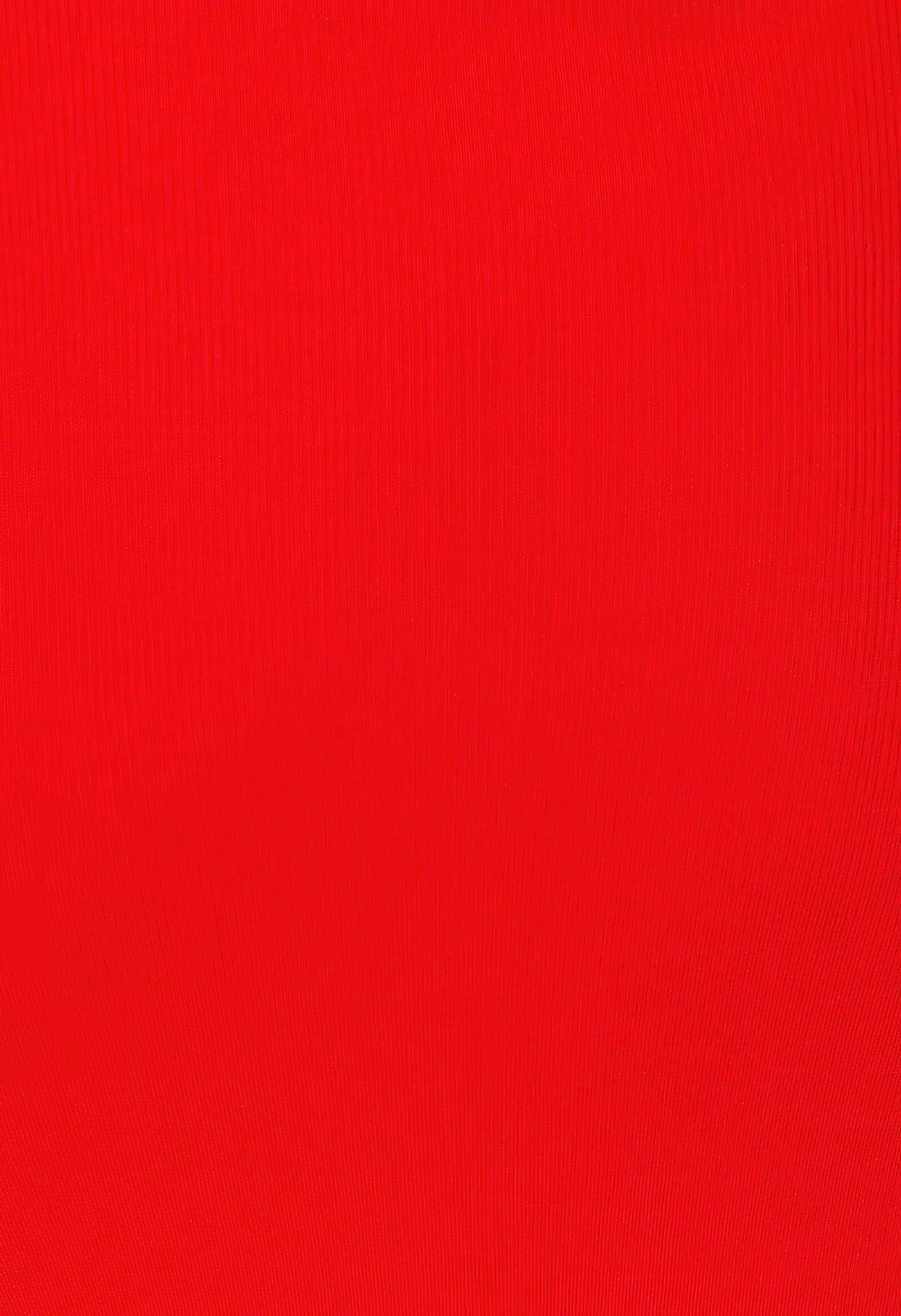Close-up of vibrant red fabric for red side slit summer dress by VacationGrabs