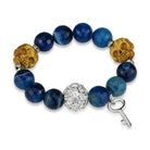 Rhodium brass skull bracelet featuring blue agate beads and a decorative key charm