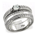 Rhodium plated CZ wedding band with sparkling center stone and intricate detailing for elegant wear