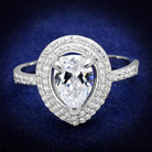 Stunning rhodium plated silver engagement ring with a pear-shaped center stone and sparkling accents