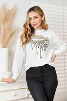 Trendsi round neck casual sweatshirt in white with leopard print drip design for stylish comfort