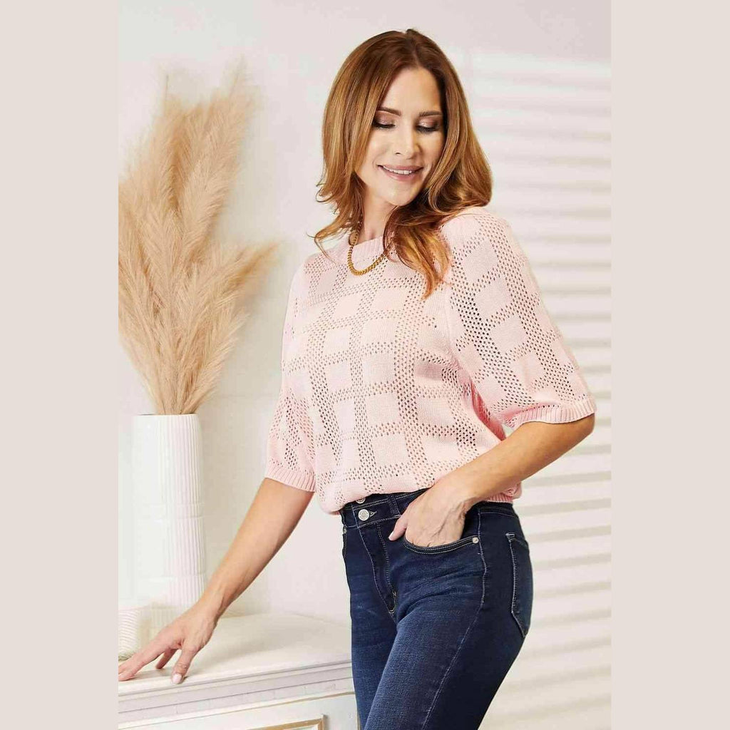 Stylish women's round neck knit top in soft pink with short puff sleeves, perfect for casual wear
