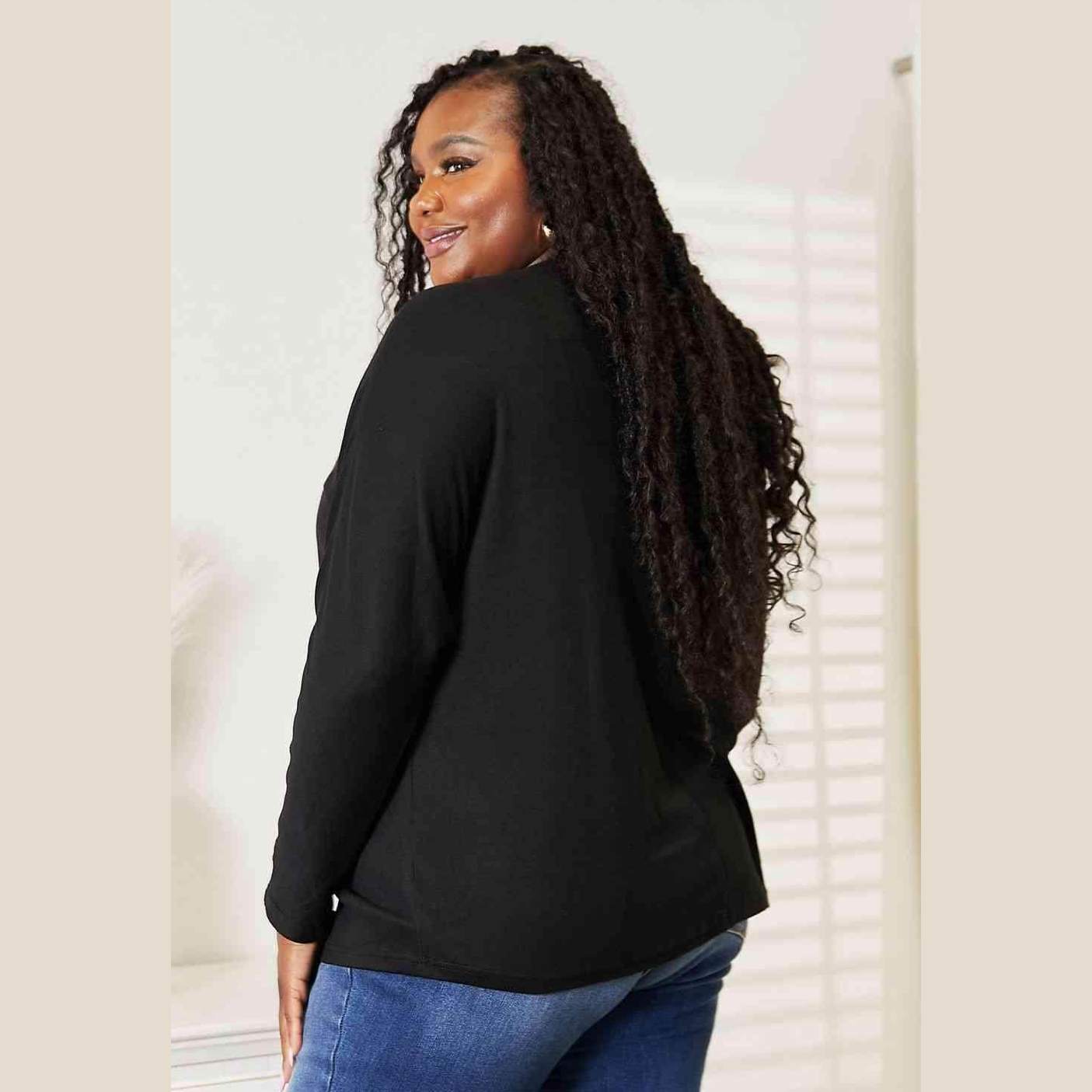 Trendsi women's black round neck long sleeve top with a relaxed fit for casual wear