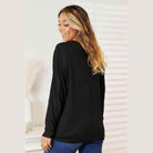 Trendsi women's round neck long sleeve top in black, featuring a relaxed fit and soft fabric
