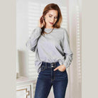 Trendsi round neck long sleeve top in gray paired with high-waisted jeans for a chic look
