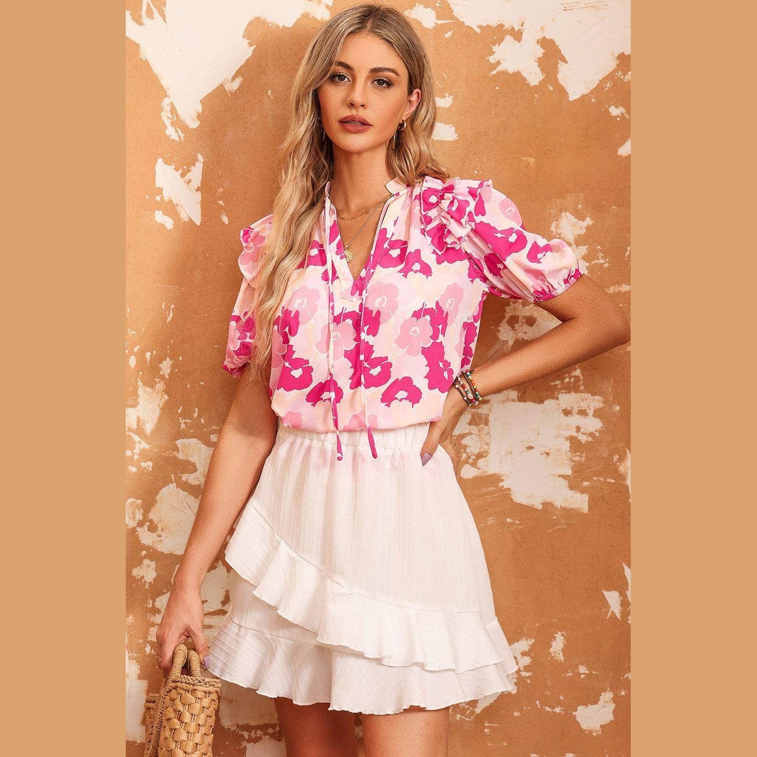 Trendsi women's ruffle shoulder blouse featuring a floral design and short puff sleeves for stylish summer outfits