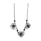 VacationGrabs ruthenium metal necklace featuring heart-shaped wire designs and black beads